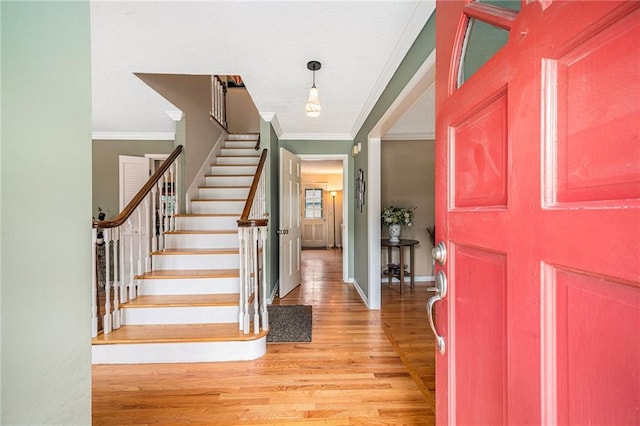 9412 Delmar St, Prairie Village, KS 66207 - entrance foyer with ornamental molding, light wood-style flooring, and stairway