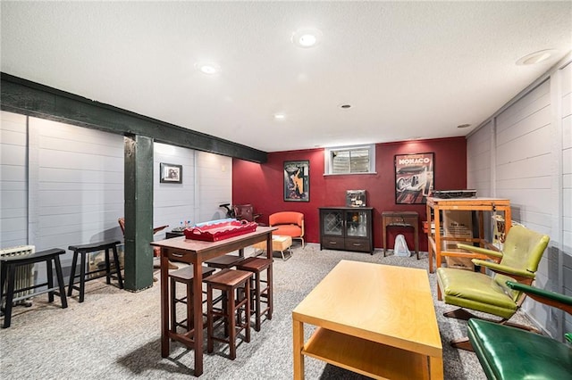 9412 Delmar St, Prairie Village, KS 66207 - rec room with concrete block wall, carpet flooring, recessed lighting, and a textured ceiling