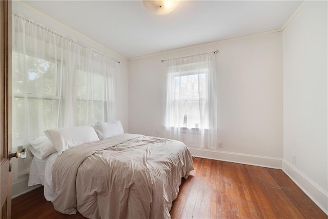 3029 E 7th St, Kansas City, MO 64124 - bedroom with ornamental molding and hardwood / wood-style flooring