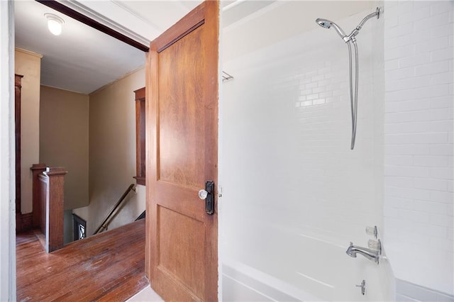 3029 E 7th St, Kansas City, MO 64124 - bathroom with shower / bathtub combination and wood finished floors