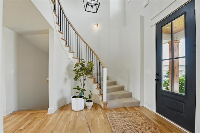 16555 S Lichtenauer Dr, Olathe, KS 66062 - foyer entrance with wood finished floors, stairs, and a high ceiling