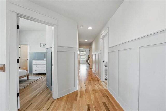 16555 S Lichtenauer Dr, Olathe, KS 66062 - corridor with a decorative wall, a wainscoted wall, light wood-style flooring, and recessed lighting