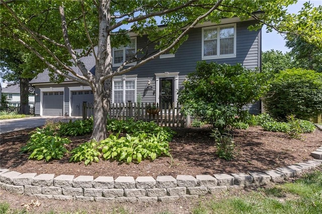 11533 Robinson St, Overland Park, KS 66210 - view of front of home with driveway and a garage