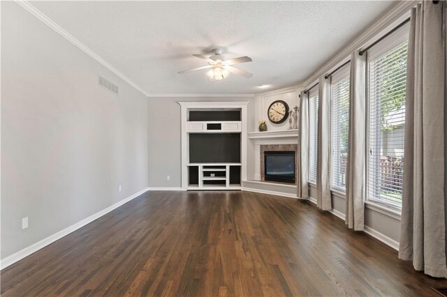 17940 W 158th Ct, Olathe, KS 66062 - unfurnished living room with built in features, a ceiling fan, dark wood-style floors, plenty of natural light, and crown molding