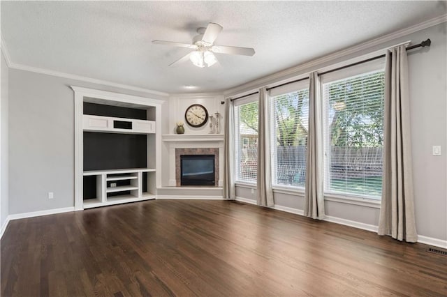 17940 W 158th Ct, Olathe, KS 66062 - unfurnished living room featuring a textured ceiling, crown molding, wood finished floors, a tiled fireplace, and built in shelves