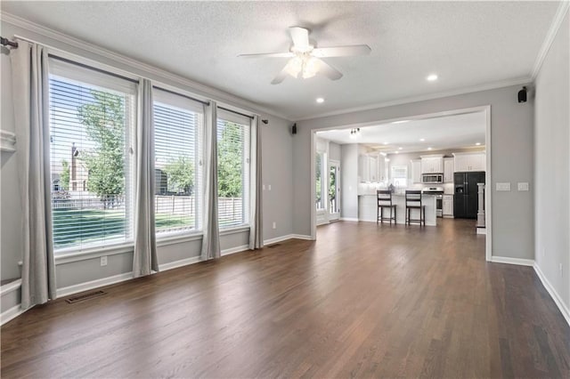 17940 W 158th Ct, Olathe, KS 66062 - unfurnished living room with a ceiling fan, ornamental molding, dark wood-style flooring, and a textured ceiling