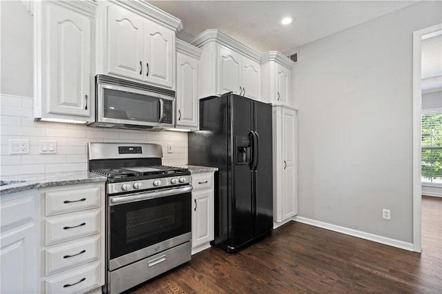 17940 W 158th Ct, Olathe, KS 66062 - kitchen featuring appliances with stainless steel finishes, light stone countertops, dark wood-style floors, white cabinets, and recessed lighting