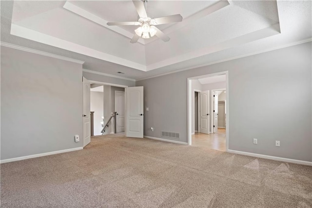 17940 W 158th Ct, Olathe, KS 66062 - unfurnished bedroom featuring a raised ceiling, light carpet, ornamental molding, and a ceiling fan