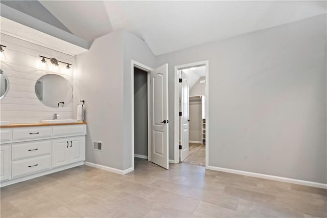 17940 W 158th Ct, Olathe, KS 66062 - bathroom featuring double vanity and vaulted ceiling