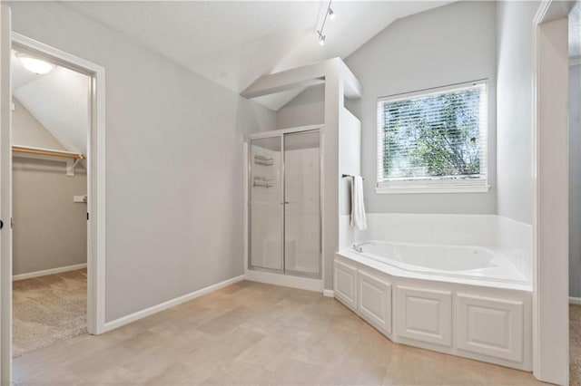 17940 W 158th Ct, Olathe, KS 66062 - full bathroom featuring vaulted ceiling, a stall shower, a bath, and a spacious closet