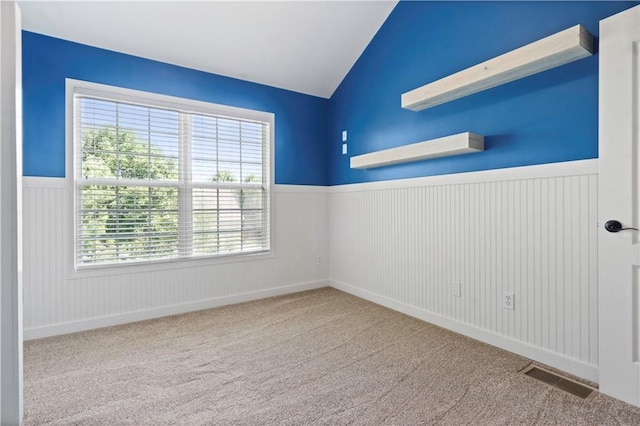 17940 W 158th Ct, Olathe, KS 66062 - spare room featuring wainscoting, carpet, and vaulted ceiling