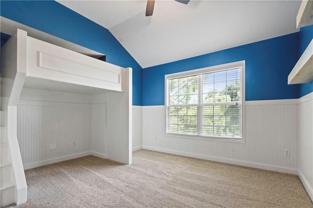 17940 W 158th Ct, Olathe, KS 66062 - unfurnished bedroom featuring lofted ceiling, a wainscoted wall, carpet, and ceiling fan