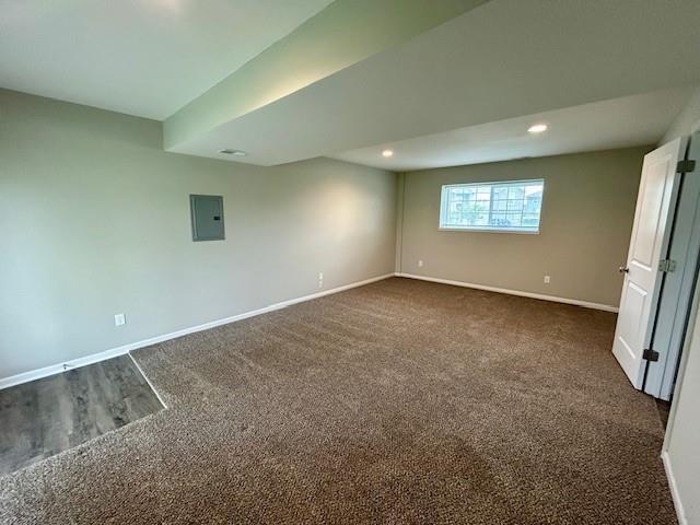 21800 Southcreek Rd, Peculiar, MO 64078 - empty room with electric panel, dark colored carpet, and recessed lighting