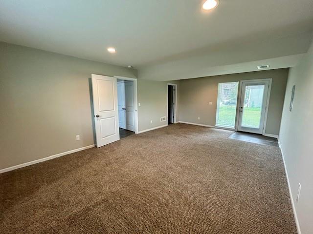 21800 Southcreek Rd, Peculiar, MO 64078 - unfurnished room with dark colored carpet and recessed lighting