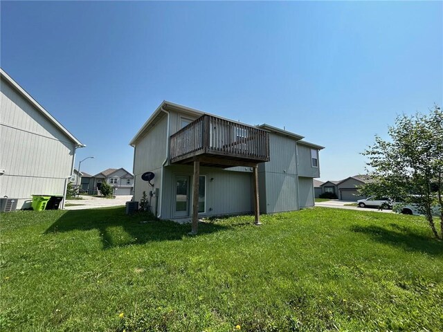 21800 Southcreek Rd, Peculiar, MO 64078 - back of property with a yard and a deck