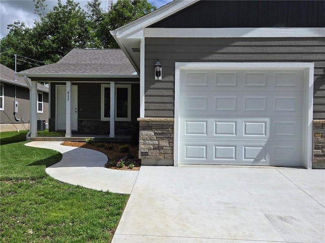 822 Carolina St, Neodesha, KS 66757 - view of front of home with concrete driveway, stone siding, a porch, roof with shingles, and a front lawn