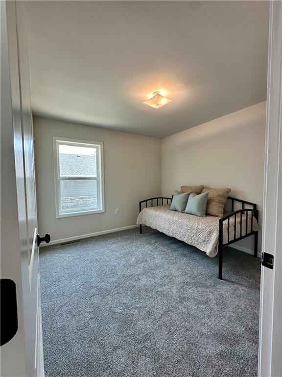 822 Carolina St, Neodesha, KS 66757 - bedroom with carpet floors and baseboards
