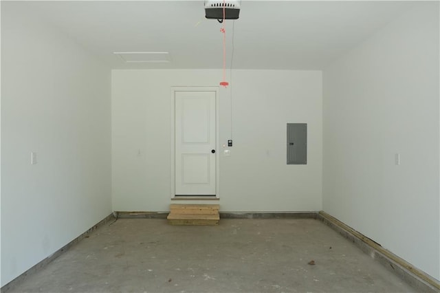 822 Carolina St, Neodesha, KS 66757 - garage featuring electric panel and a garage door opener