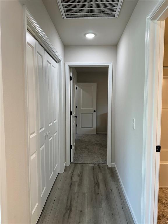 822 Carolina St, Neodesha, KS 66757 - hall featuring baseboards and wood finished floors