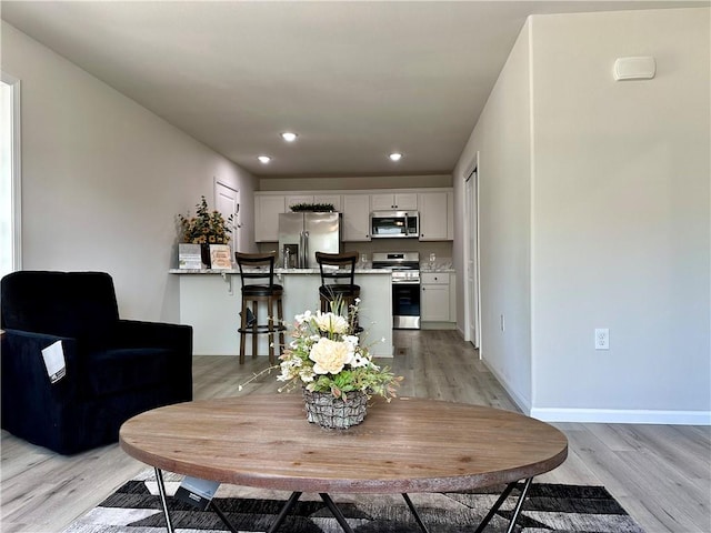 822 Carolina St, Neodesha, KS 66757 - dining area with light wood-style floors and recessed lighting