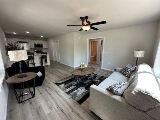 822 Carolina St, Neodesha, KS 66757 - living area with light wood-type flooring, ceiling fan, and recessed lighting