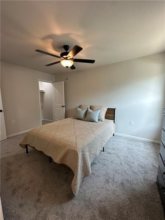 822 Carolina St, Neodesha, KS 66757 - bedroom with carpet floors and ceiling fan