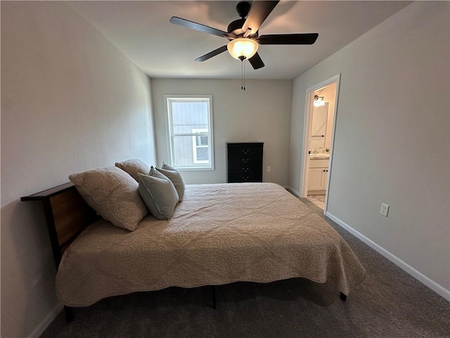 822 Carolina St, Neodesha, KS 66757 - bedroom with carpet floors, connected bathroom, and a ceiling fan