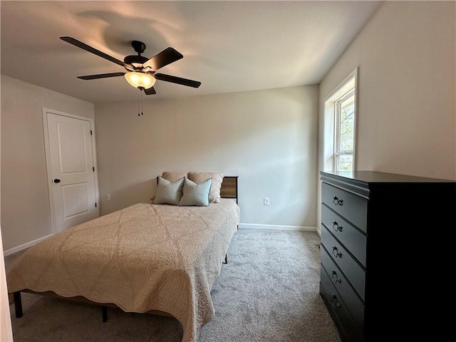 822 Carolina St, Neodesha, KS 66757 - carpeted bedroom with baseboards and ceiling fan