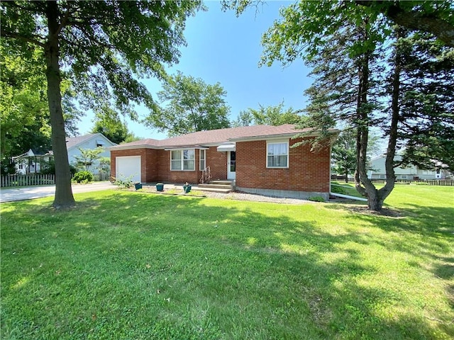 311 SW 12th Ter, Concordia, MO 64020 - ranch-style house featuring an attached garage, brick siding, and driveway