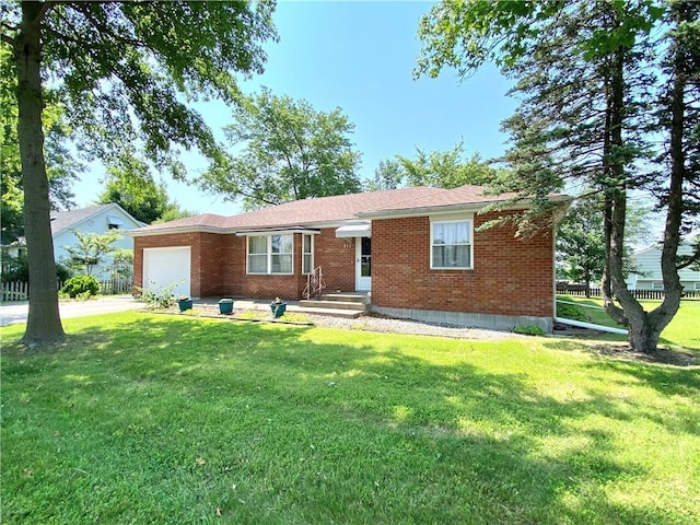 311 SW 12th Ter, Concordia, MO 64020 - ranch-style home featuring a garage, brick siding, a front lawn, and concrete driveway