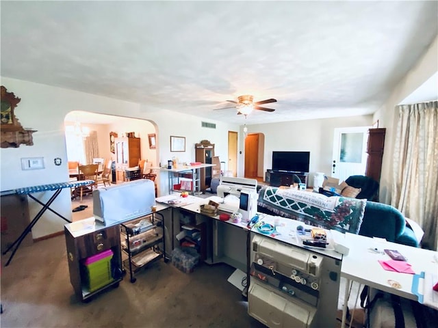 311 SW 12th Ter, Concordia, MO 64020 - office space featuring arched walkways, ceiling fan, and a chandelier
