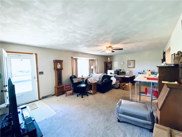 311 SW 12th Ter, Concordia, MO 64020 - living area with carpet floors and a ceiling fan