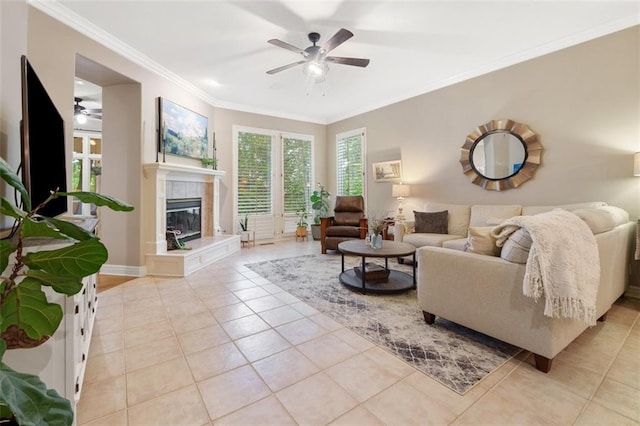 10181 S Shadow Cir, Olathe, KS 66061 - living room featuring ceiling fan, light tile patterned floors, crown molding, and a tiled fireplace