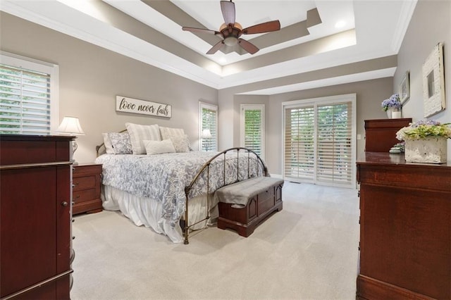 10181 S Shadow Cir, Olathe, KS 66061 - bedroom featuring light colored carpet, access to outside, multiple windows, a tray ceiling, and crown molding