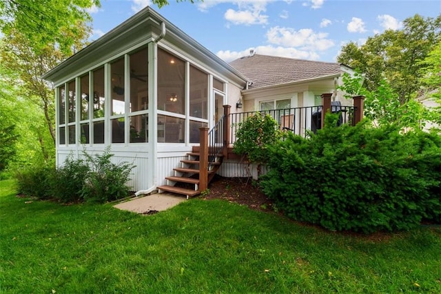 10181 S Shadow Cir, Olathe, KS 66061 - back of house featuring a yard, a sunroom, and stairs