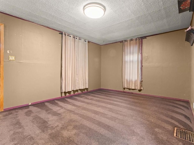 2605 S 15th St, Saint Joseph, MO 64503 - spare room featuring carpet floors and a textured ceiling