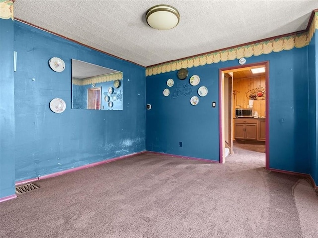 2605 S 15th St, Saint Joseph, MO 64503 - carpeted empty room with a textured ceiling
