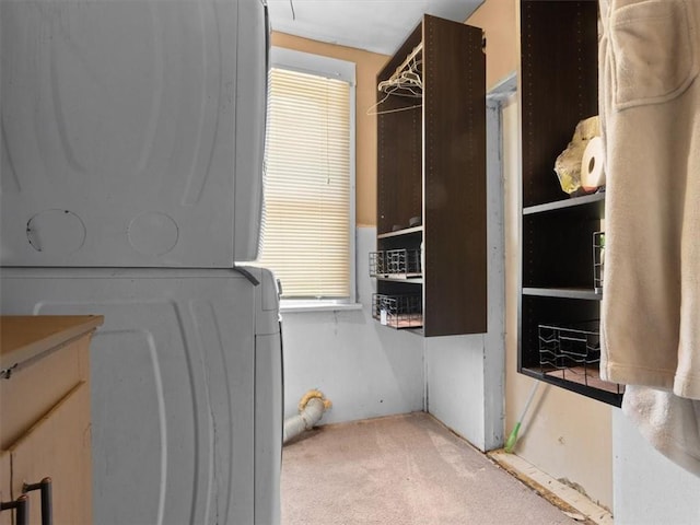 2605 S 15th St, Saint Joseph, MO 64503 - laundry area with stacked washer and clothes dryer and light carpet