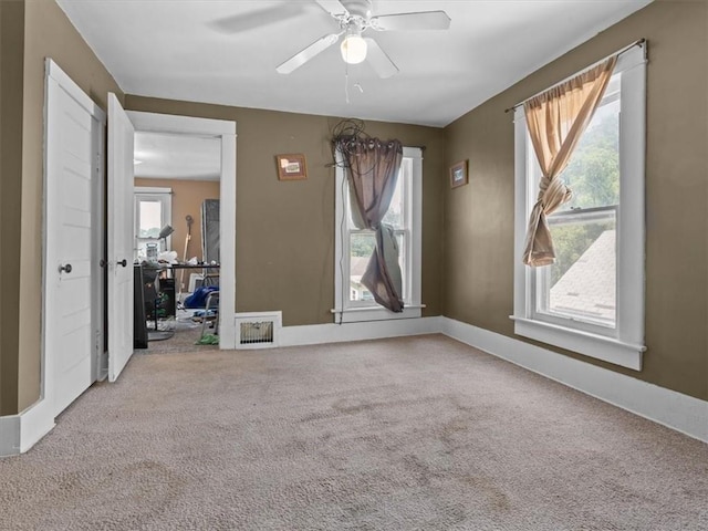 2605 S 15th St, Saint Joseph, MO 64503 - spare room with carpet floors, plenty of natural light, and ceiling fan