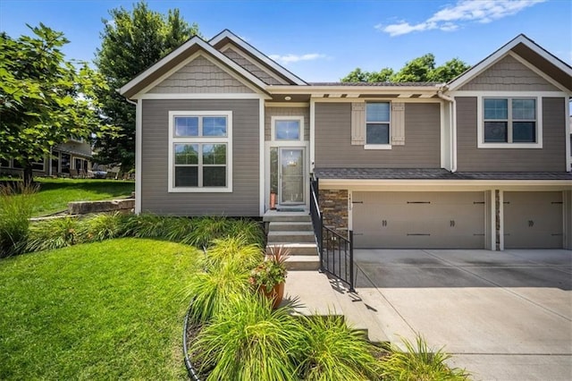 14115 NW 68th St, Parkville, MO 64152 - view of front of house with an attached garage, concrete driveway, a front yard, and stone siding