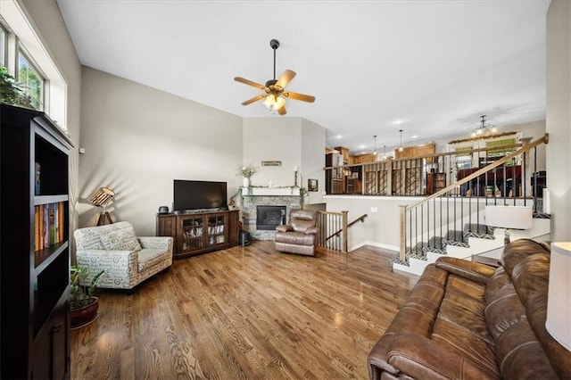 14115 NW 68th St, Parkville, MO 64152 - living room with a ceiling fan, stairway, wood finished floors, and a fireplace