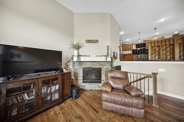 14115 NW 68th St, Parkville, MO 64152 - living room featuring wood finished floors, a stone fireplace, and recessed lighting