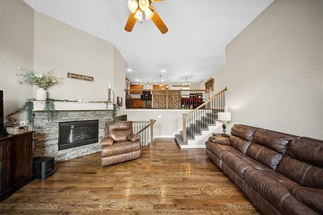 14115 NW 68th St, Parkville, MO 64152 - living room with wood finished floors, ceiling fan, a fireplace, and stairs