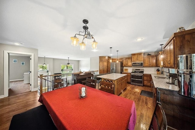 14115 NW 68th St, Parkville, MO 64152 - dining space with dark wood-type flooring and a chandelier