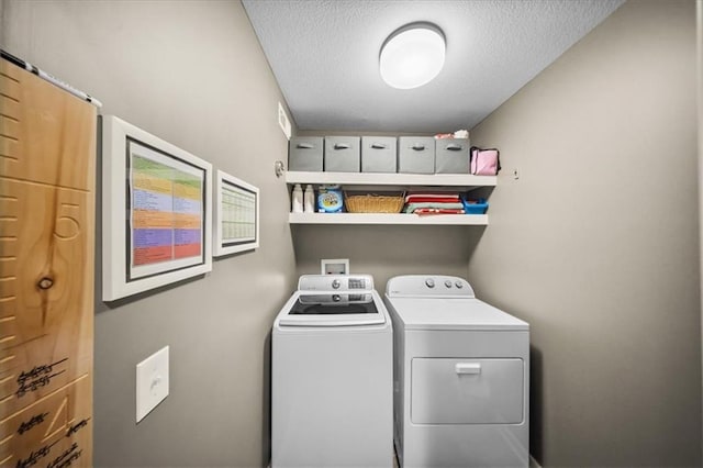 14115 NW 68th St, Parkville, MO 64152 - laundry area with separate washer and dryer and a textured ceiling