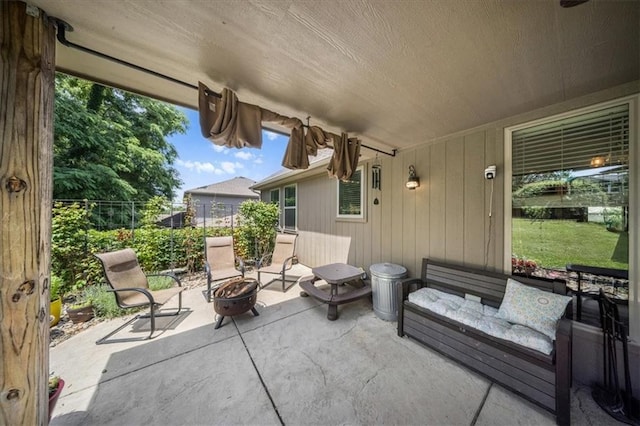 14115 NW 68th St, Parkville, MO 64152 - view of patio with a fire pit