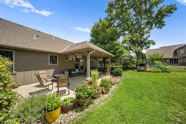 14115 NW 68th St, Parkville, MO 64152 - view of yard featuring a patio, outdoor lounge area, and a playground