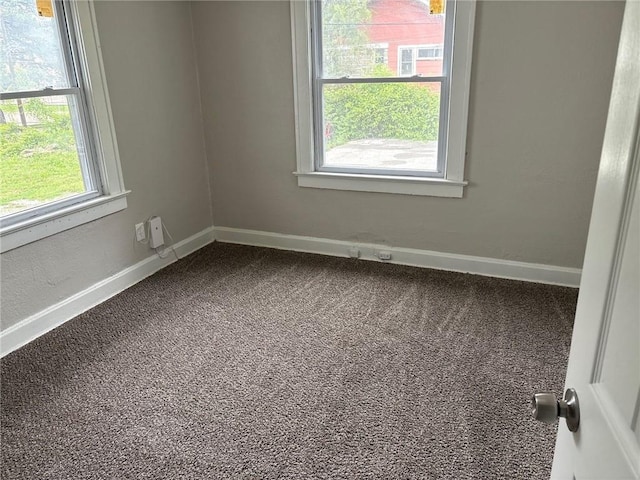 3307 Askew Ave, Kansas City, MO 64128 - carpeted spare room with baseboards