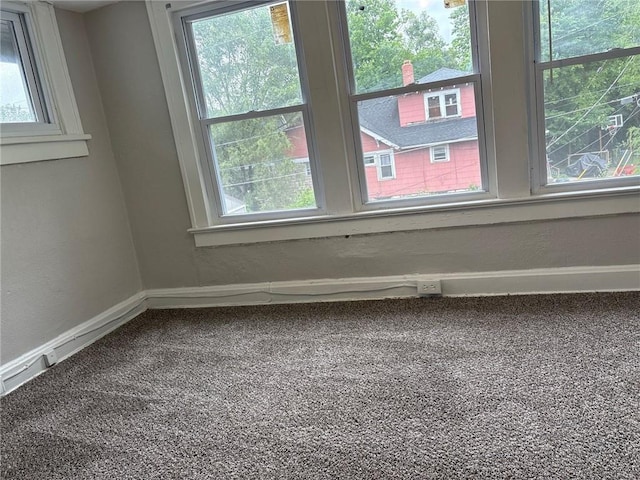 3307 Askew Ave, Kansas City, MO 64128 - carpeted spare room featuring baseboards and a textured wall