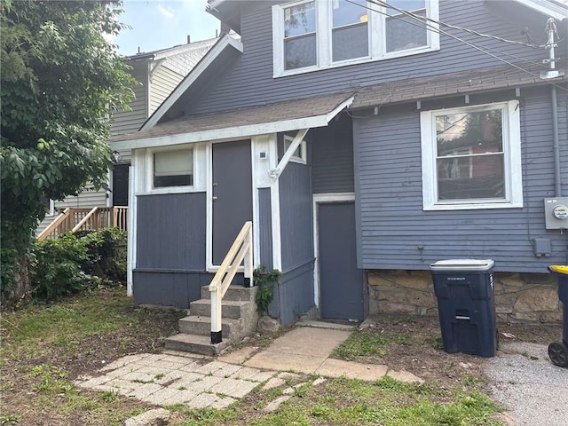 3307 Askew Ave, Kansas City, MO 64128 - view of front of property featuring entry steps and a shingled roof